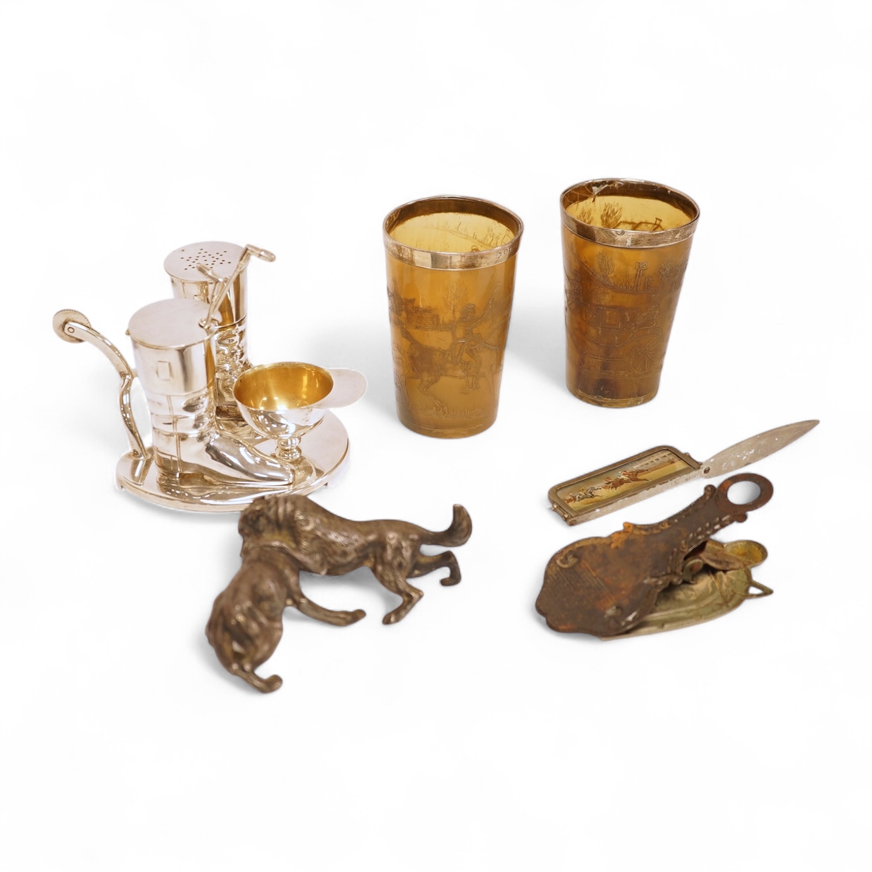 A novelty horse-related cruet stand, a pair of silver mounted horn beakers and three other items